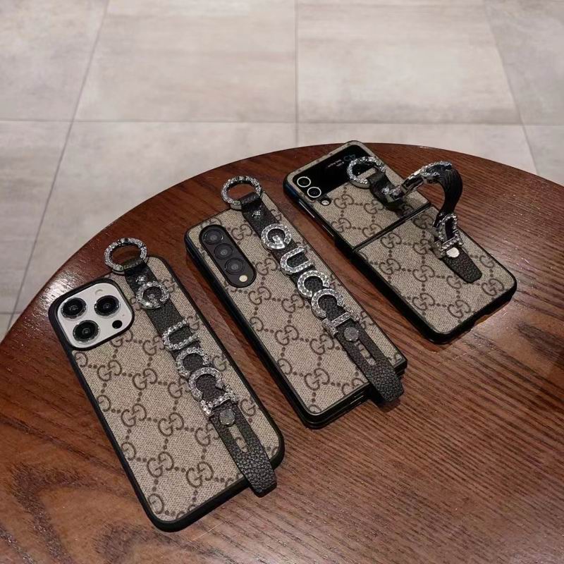 Gucci Handyhülle mit Handschlaufe für iPhone / Samsung 